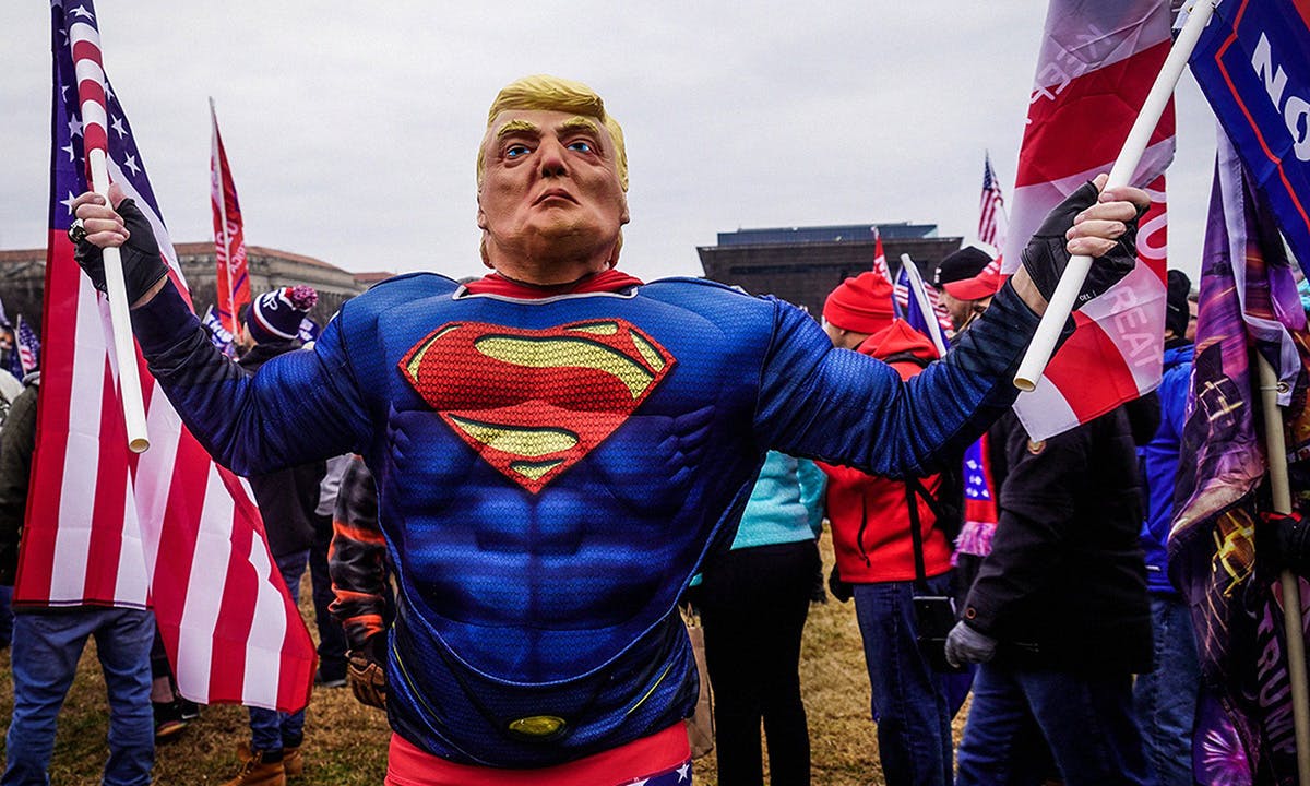 racist dressed as trump superman