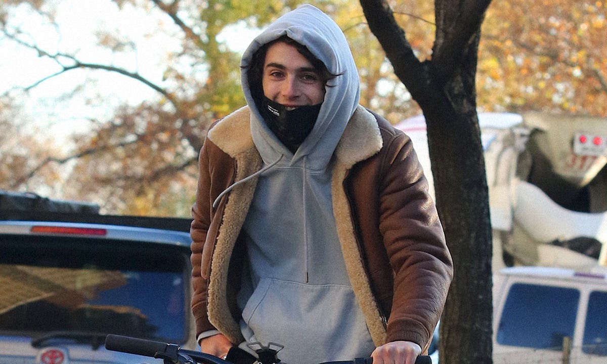 Timothee Chalamet Cooly Styles Shearling Bomber Jacket and Denim Kicks –  Footwear News