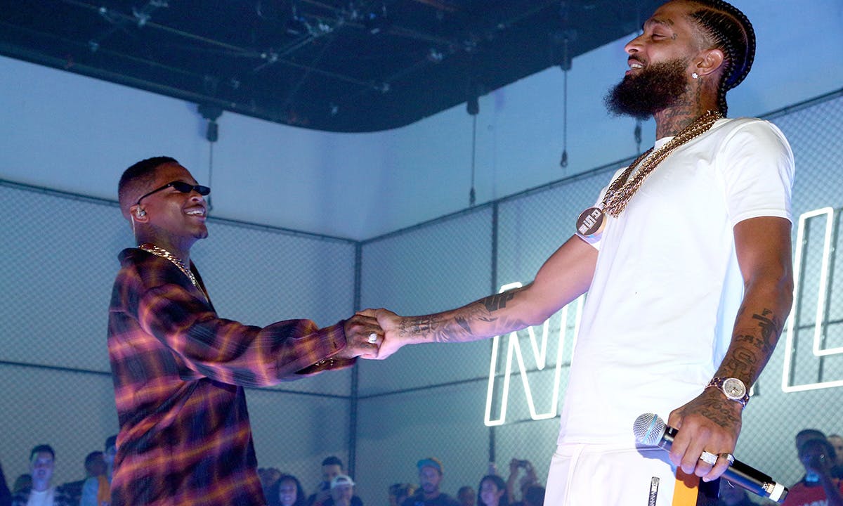 YG (L) and Nipsey Hussle perform