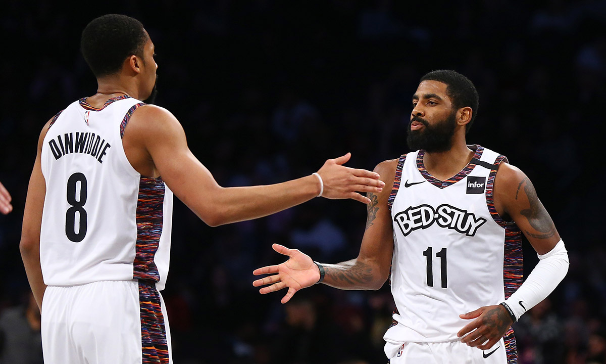Kyrie Irving #11 of the Brooklyn Nets celebrates with Spencer Dinwiddie #8