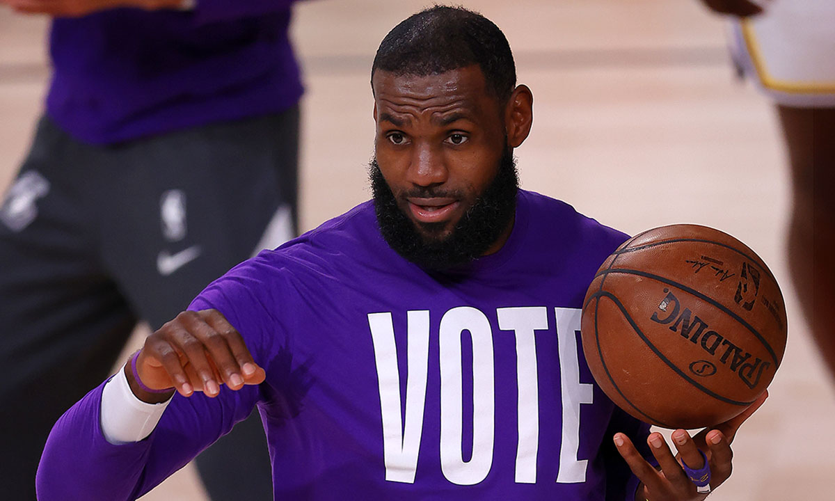 LeBron James #23 of the Los Angeles Lakers wears a VOTE shirt during warm-up