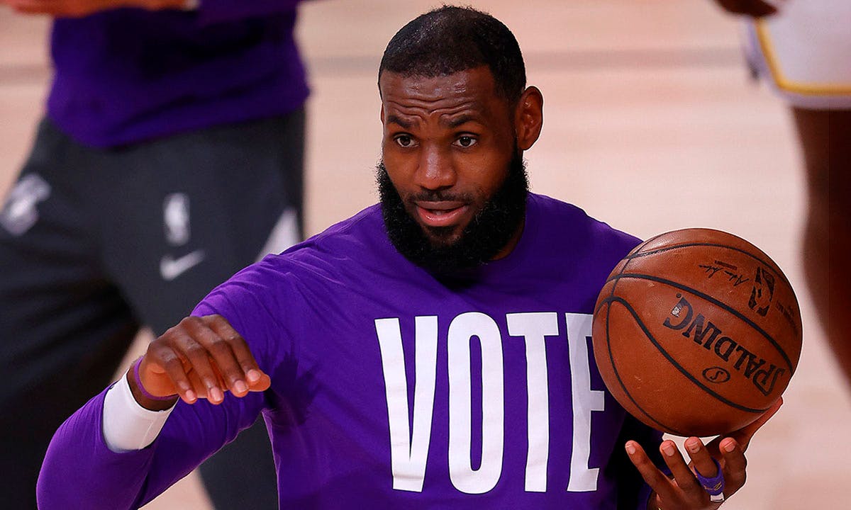 LeBron James #23 of the Los Angeles Lakers wears a VOTE shirt during warm-up