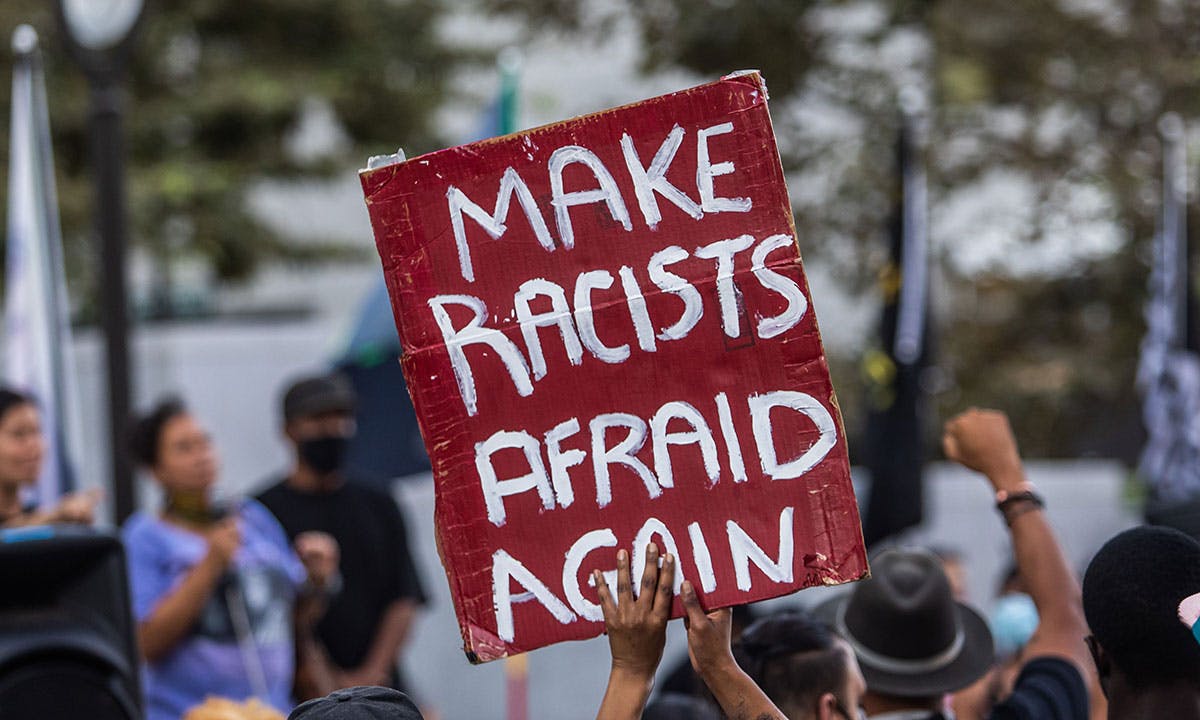 BLM protestor banner