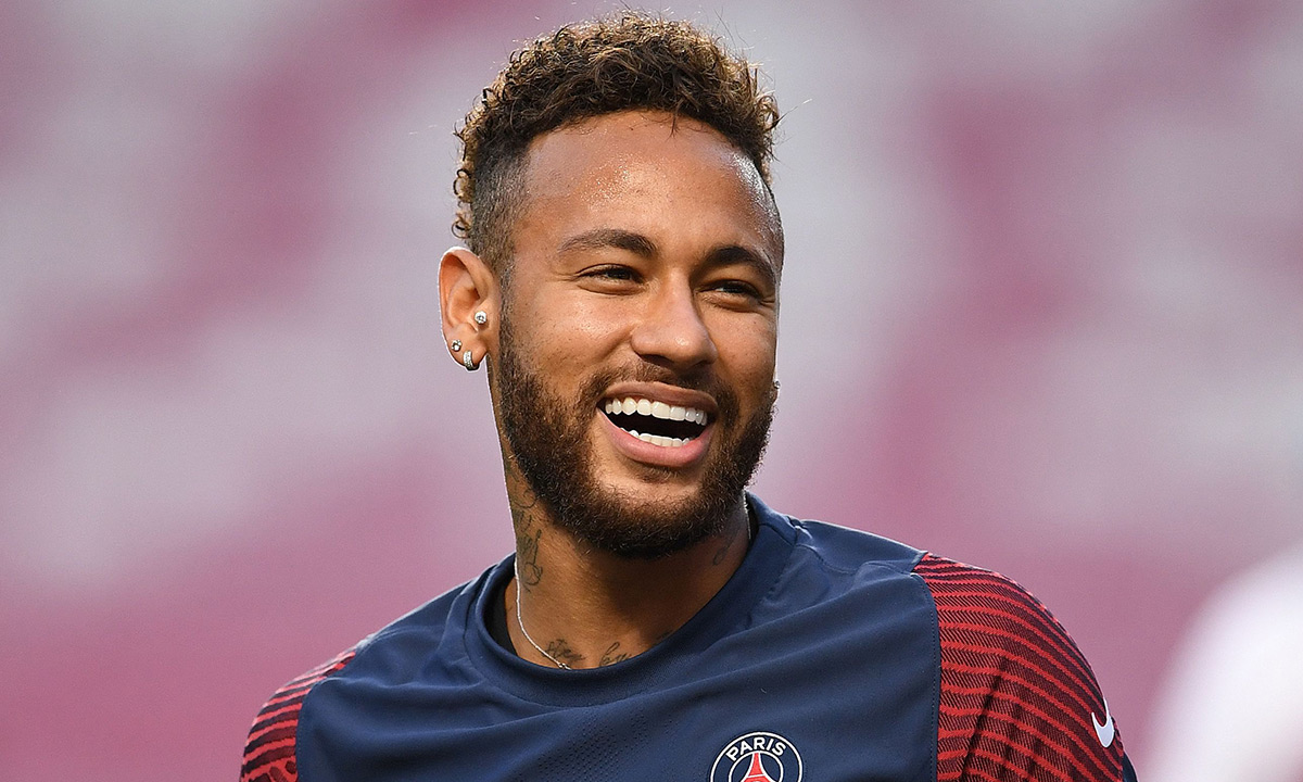 Paris Saint-Germain's Brazilian forward Neymar laughs during a training session at the Luz stadium in Lisbon