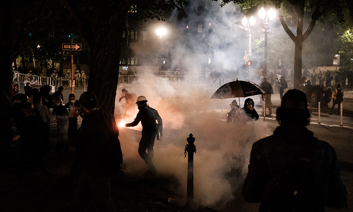 Federal officers use tear gas and other crowd dispersal munitions on protesters outside the Multnomah County Justice Cente