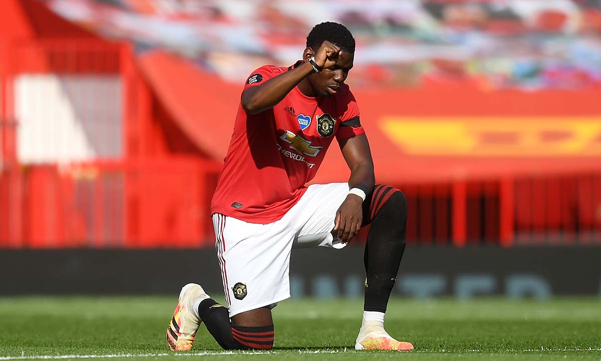 Paul Pogba of Manchester United takes a knee in support of the Black Lives Matter movement
