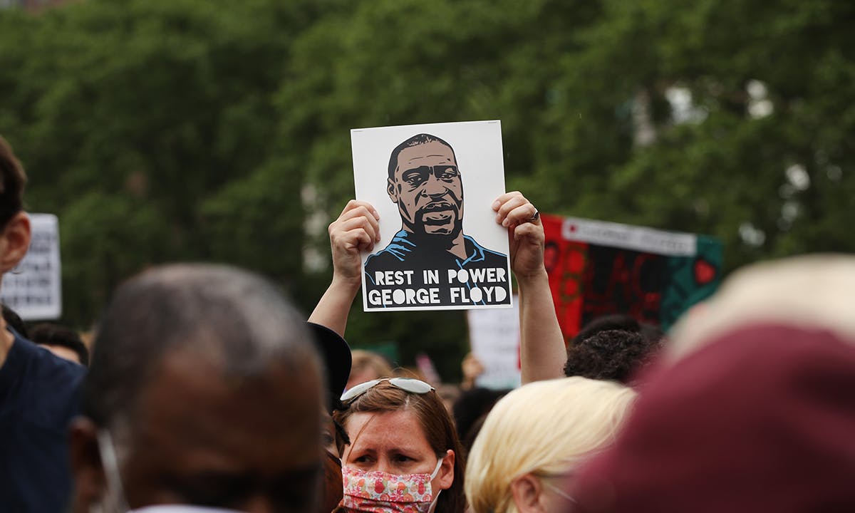 people gather in Brooklyn’s Cadman Plaza Park for a memorial service for George Floyd