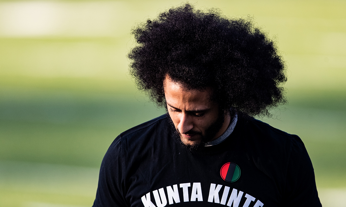 Colin Kaepernick looks on during his NFL workout