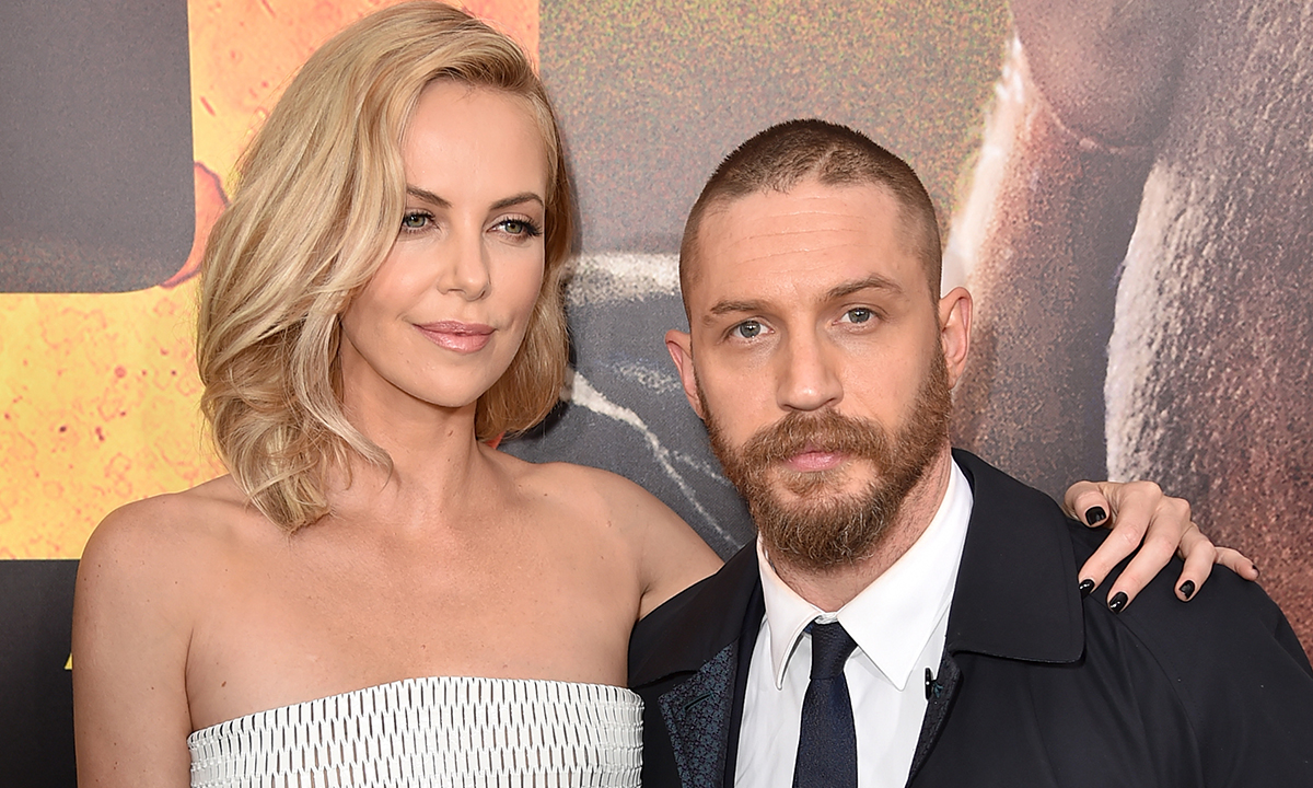 Charlize Theron (L) and Tom Hardy attend the premiere of Warner Bros. Pictures' "Mad Max: Fury Road"