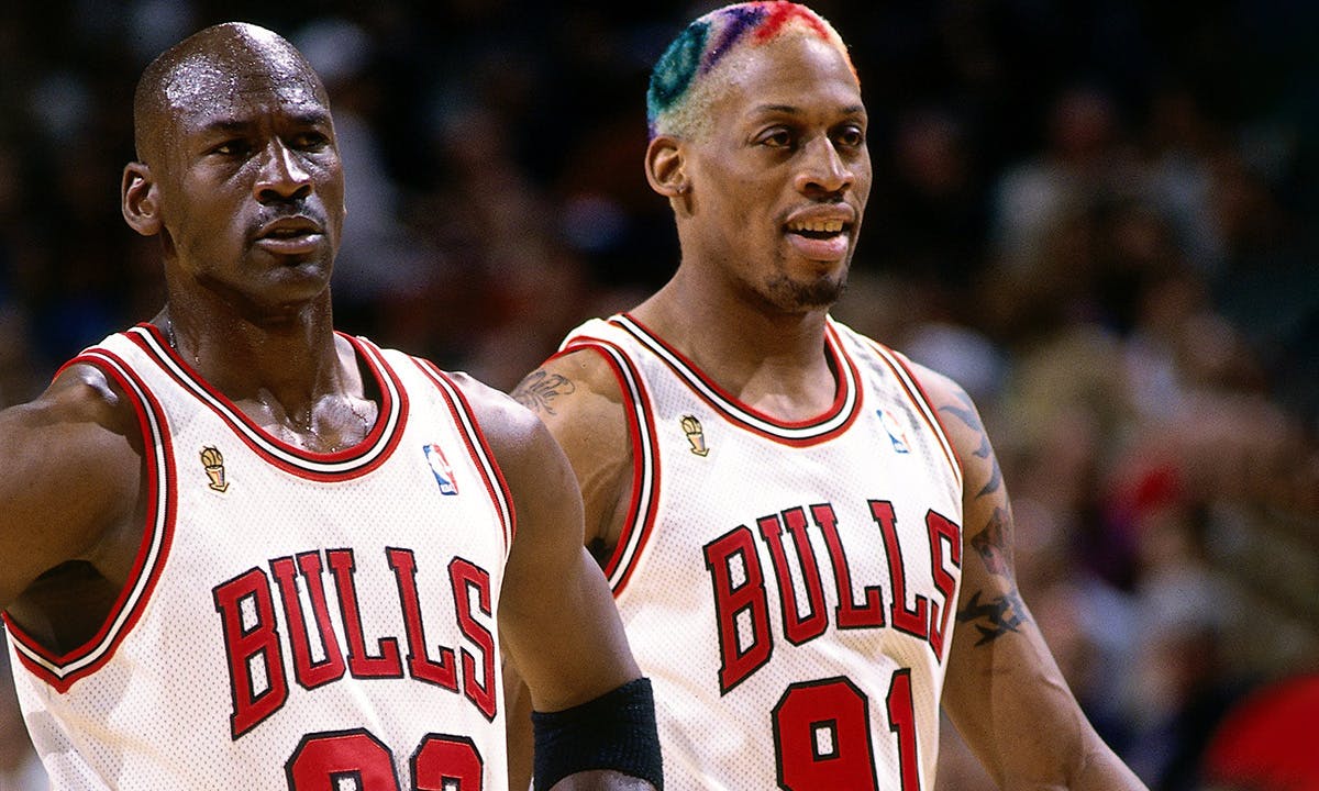 Dennis Rodman #91 and Michael Jordan #23 of the Chicago Bulls take the court during a 1996 NBA game