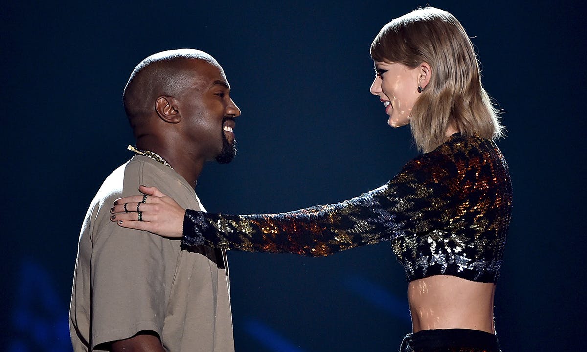 Kanye West accepts the Video Vanguard Award from recording artist Taylor Swift
