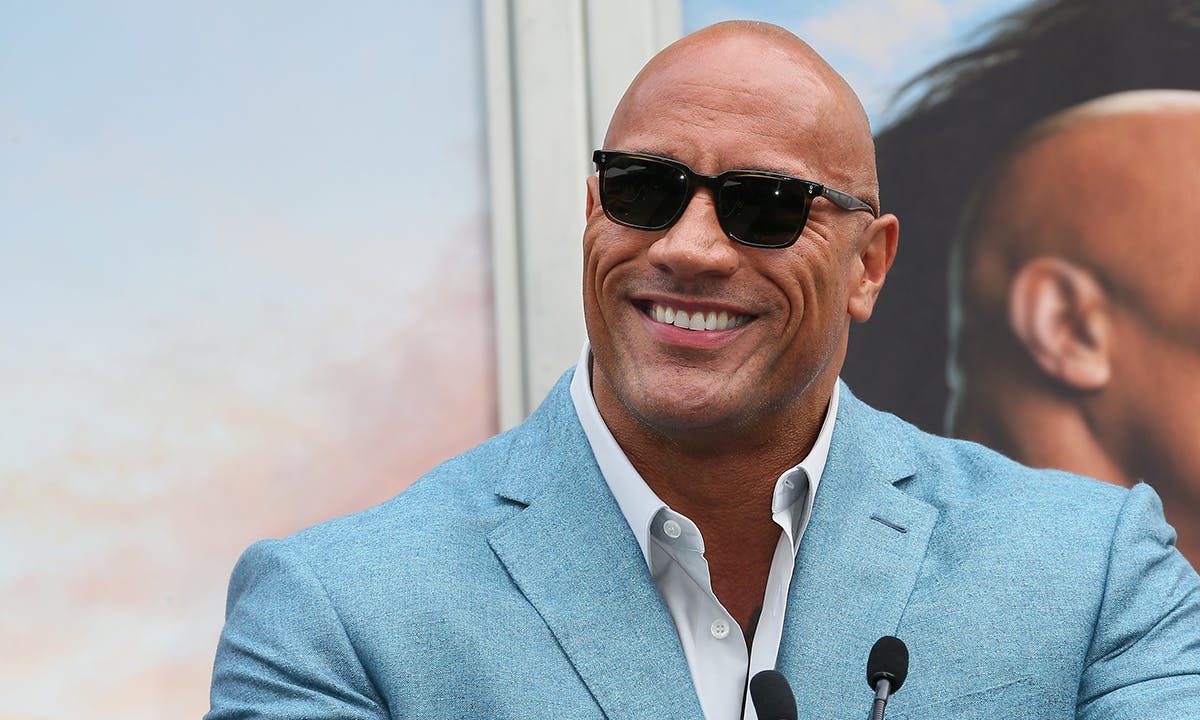 Dwayne Johnson attends a Hand and Footprint ceremony honoring Kevin Hart