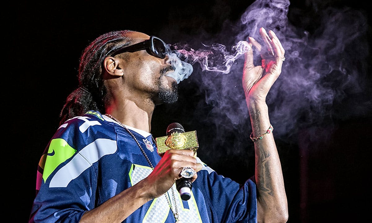 Snoop Dogg smokes a blunt on stage