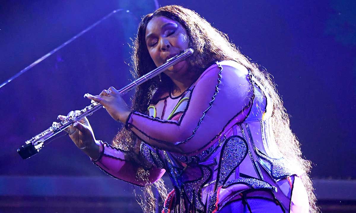 Lizzo playing the flute