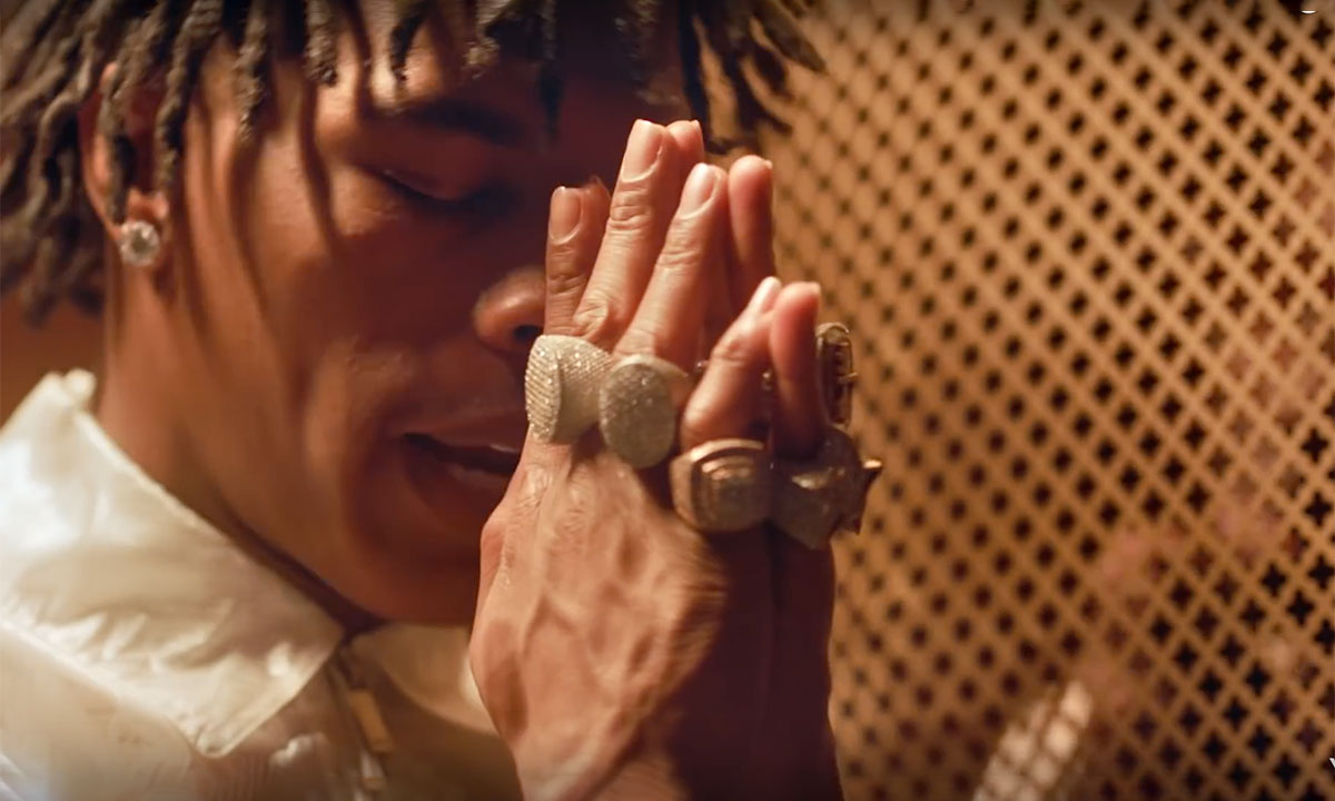 Lil Baby prays in "grace" music video