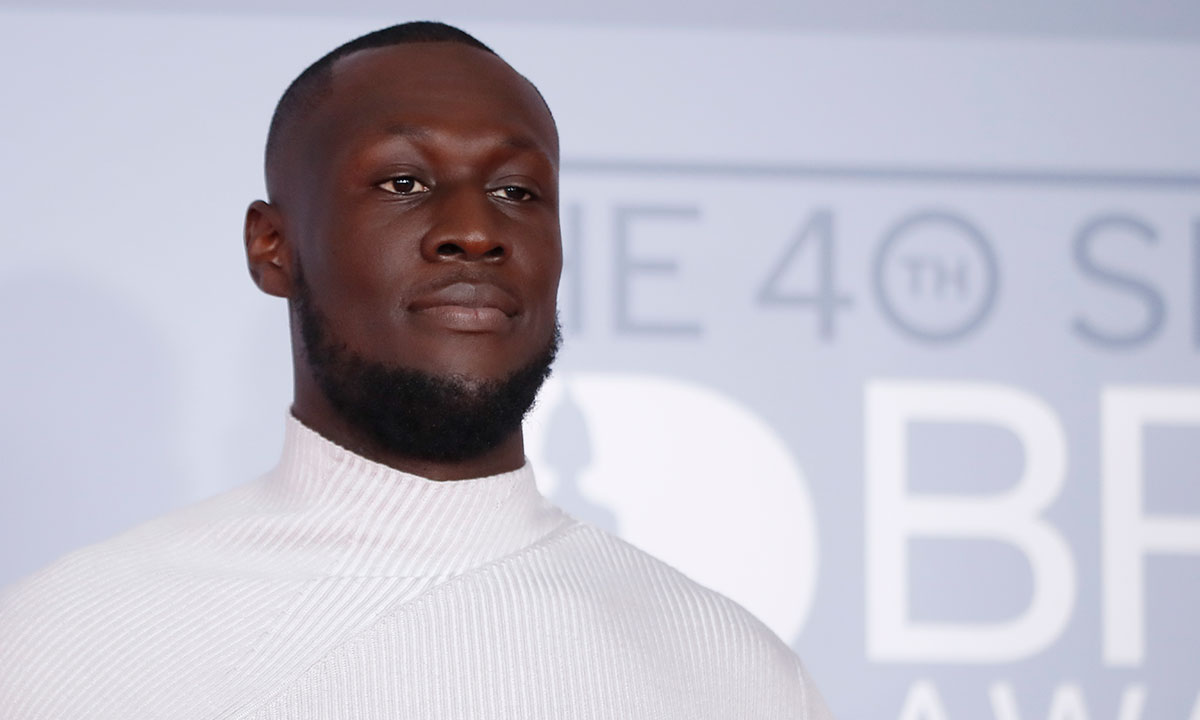 Stormzy poses on the red carpet on arrival for the BRIT Awards 2020
