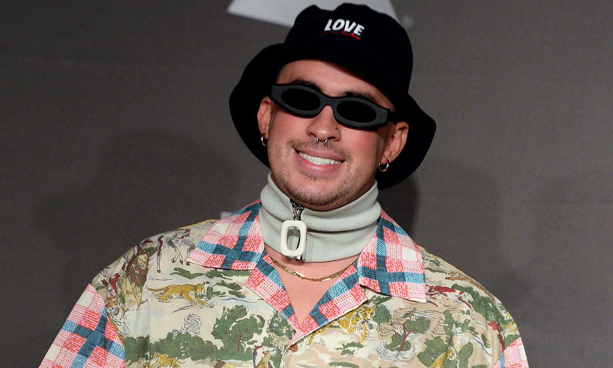 Bad Bunny poses in the press room with grammy