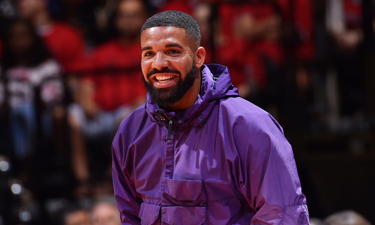 Drake smiling purple jacket