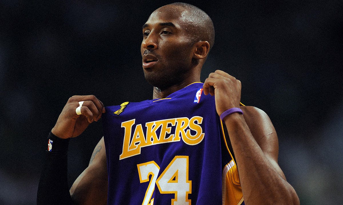 Los Angeles Lakers guard Kobe Bryant looks on as Boston Celtics guard Paul  Pierce makes a free throw at the TD Banknorth Garden in Boston on March 20,  2006. The Lakers won