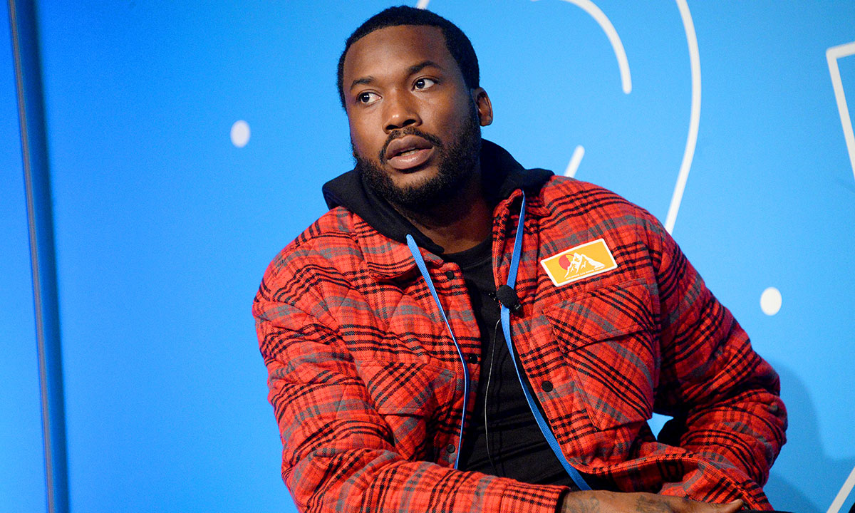 Meek Mill on stage blue background