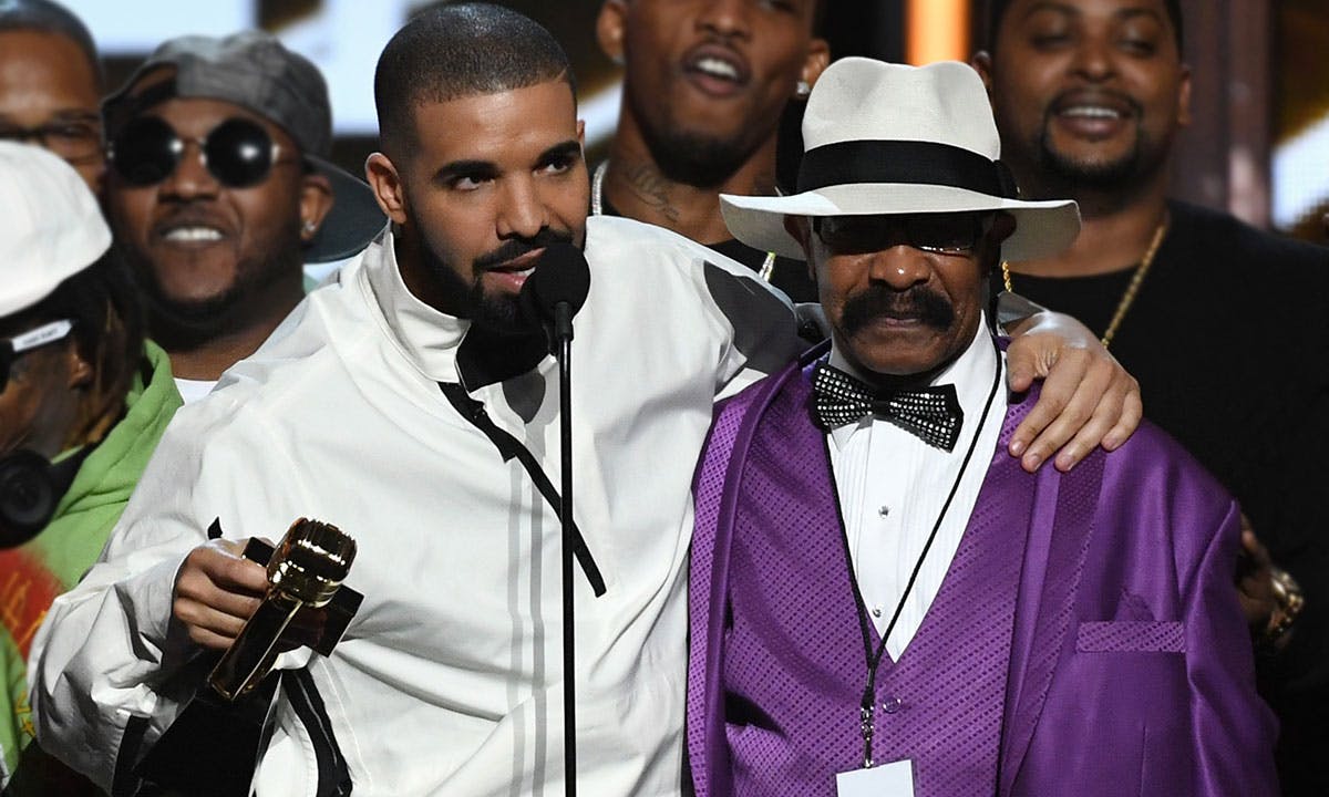 Drake and father Dennis Graham accepting award