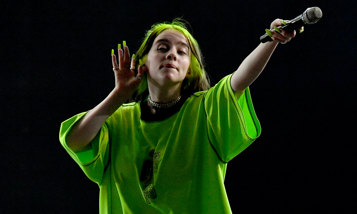 Billie Eilish performing green shirt
