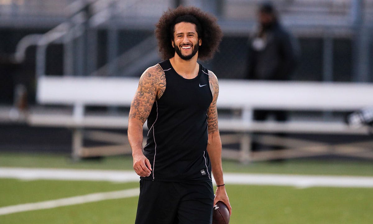 Colin Kaepernick on the field wearing Nike jersey