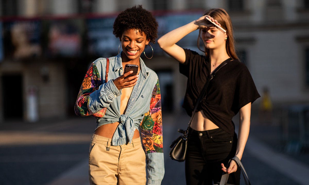 woman texting smiling