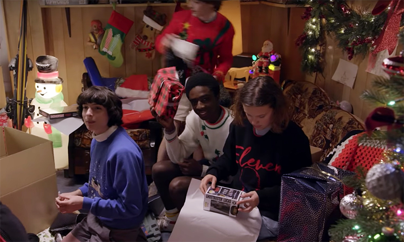 stranger things cast wraps christmas presents feature