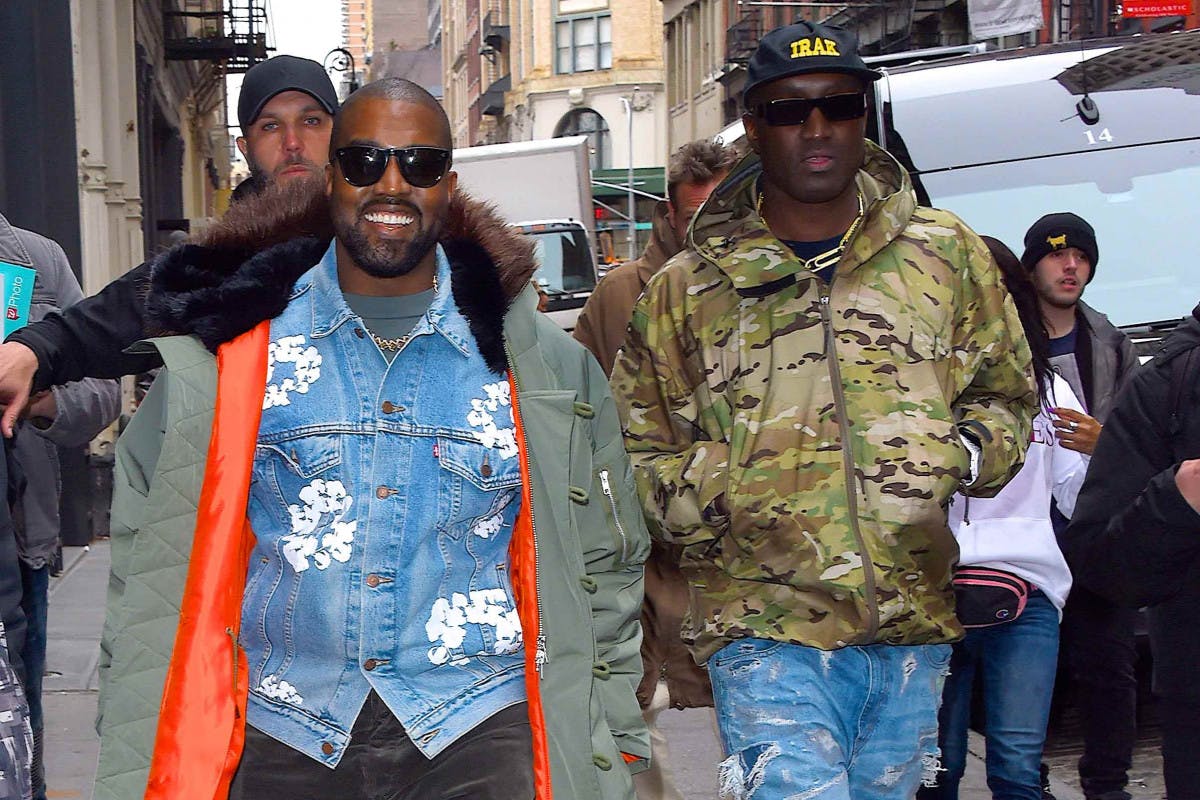 Kanye West wears red Louis Vuitton shoes that he designed at the News  Photo - Getty Images