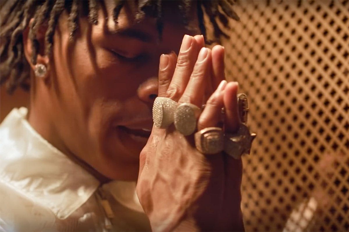 Lil Baby prays in "grace" music video