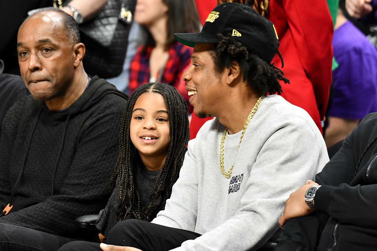 Jay-Z and Blue Ivy Carter attend a basketball game between the Los Angeles Clippers and the Los Angeles Lakers at Staples Center