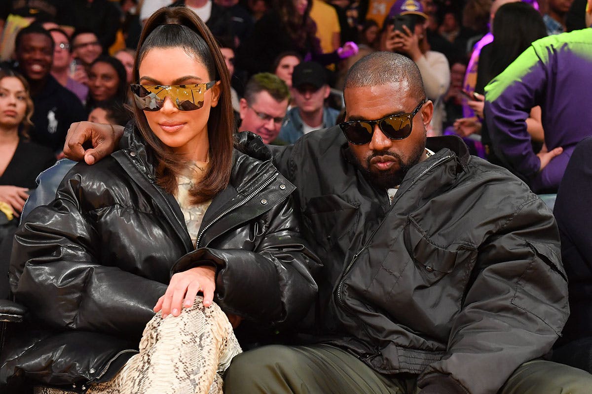 Kim Kardashian and Kanye West attend a basketball game