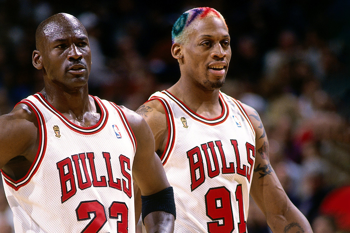 Dennis Rodman #91 and Michael Jordan #23 of the Chicago Bulls take the court during a 1996 NBA game