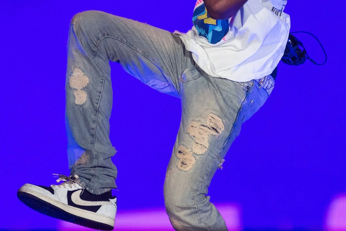 Travis Scott Wears Pharrell's Louis Vuitton With Air Jordan 1s