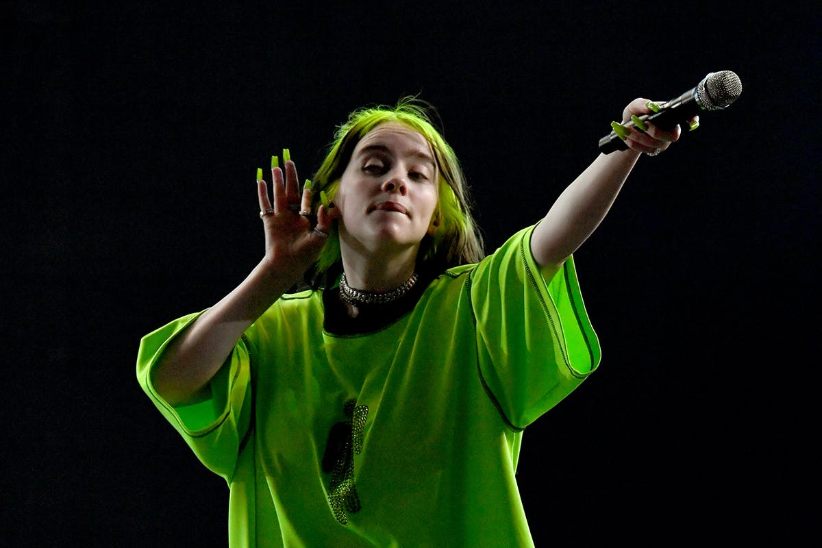 Billie Eilish performing green shirt