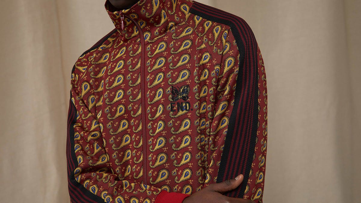 A model wears the END. x Needles track jacket