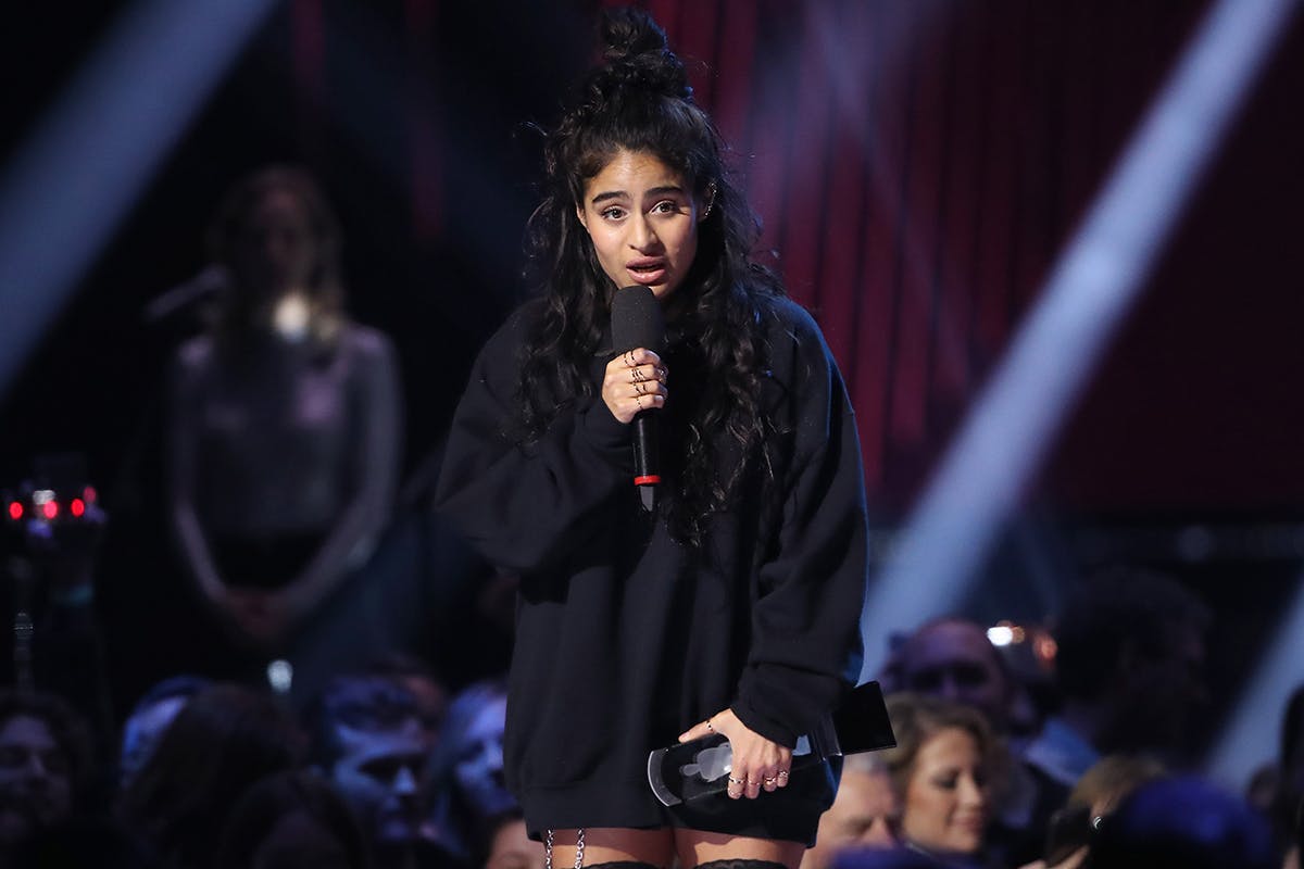 Jessie Reyez speaks after receiving an award