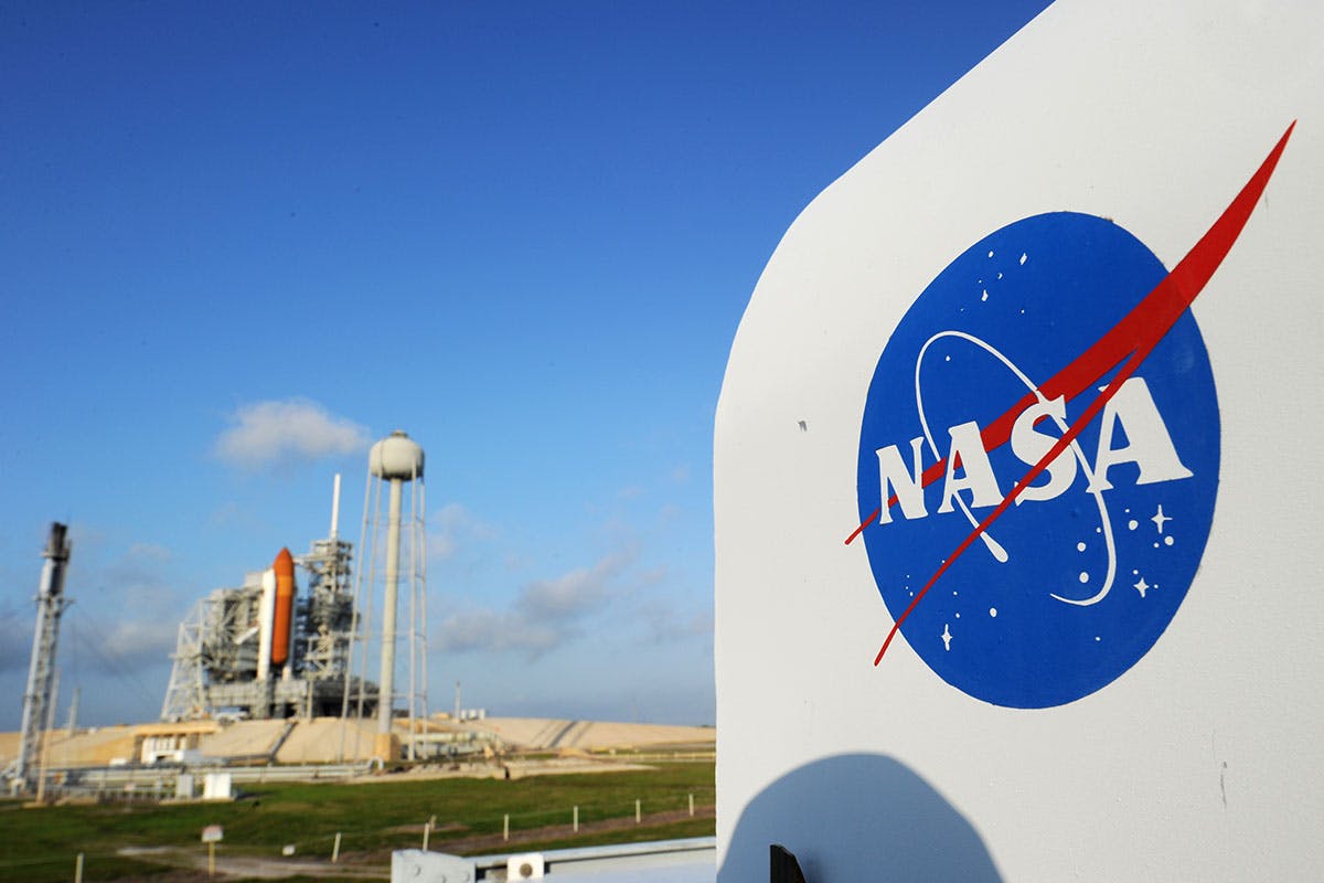 The NASA logo on a protective box for a camera near the space shuttle Endeavour