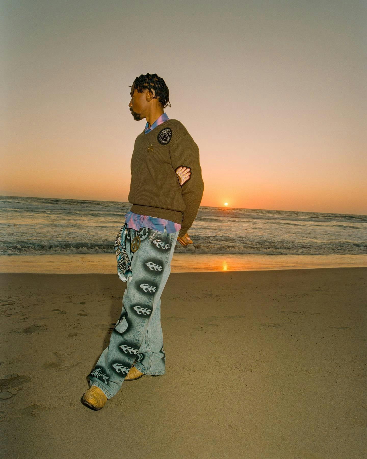 model on beach wearing stussy dries van noten collaboration