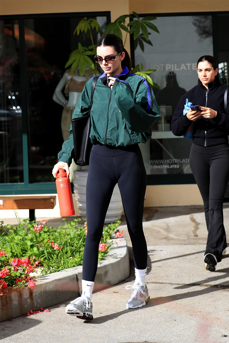 Kendall Jenner leaves pilates wearing a black top, black leggings and Nike sneakers