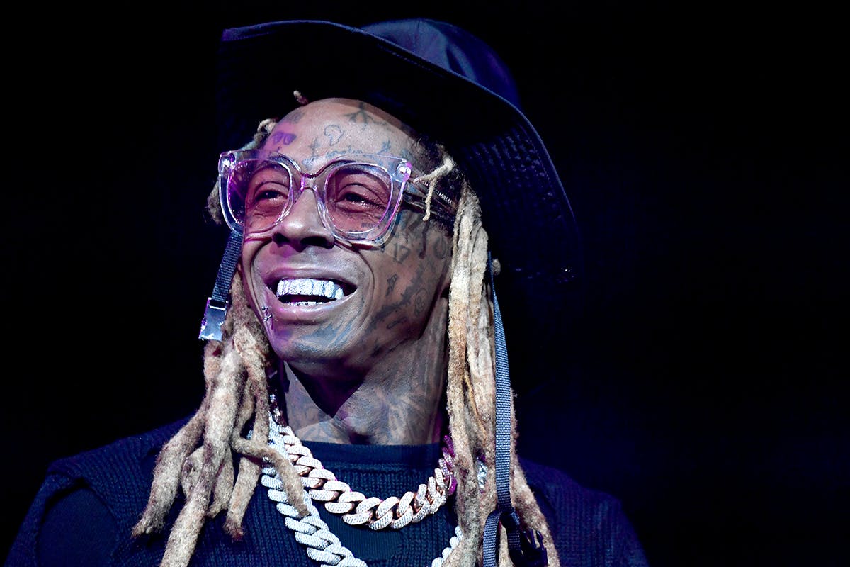 Lil Wayne glasses hat smiling