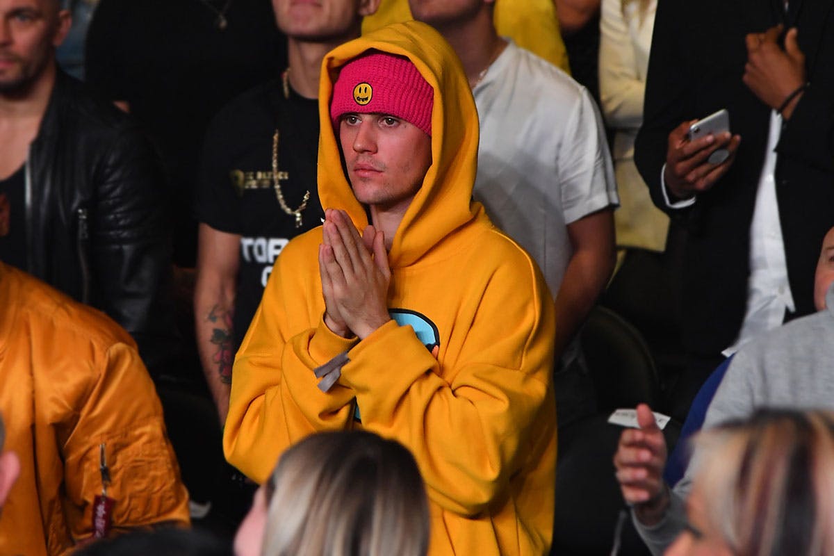 Justin Bieber stands amid crowd