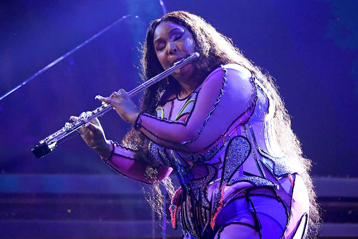 Lizzo playing the flute