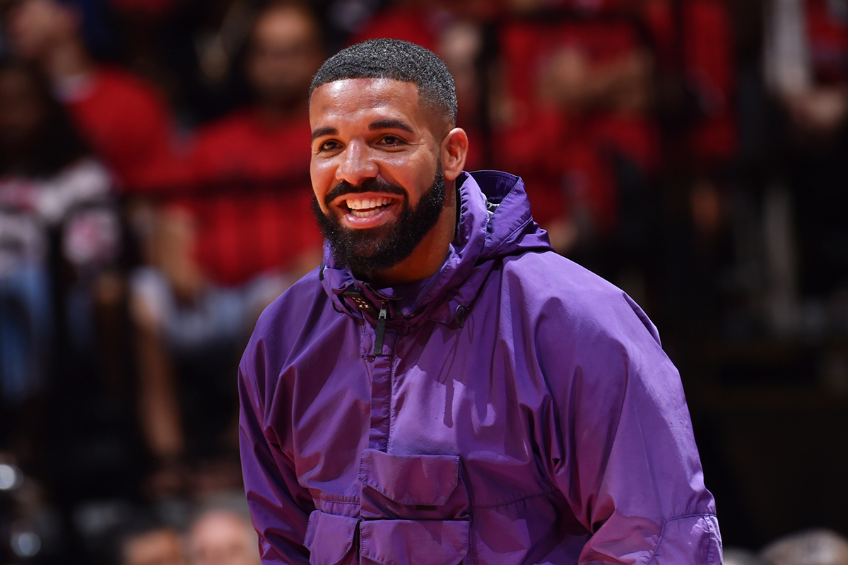 Drake smiling purple jacket