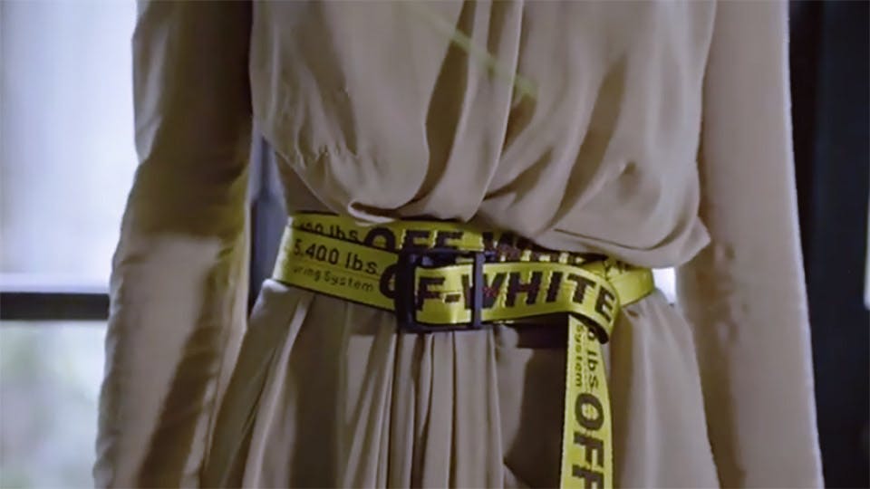 off white belt on person