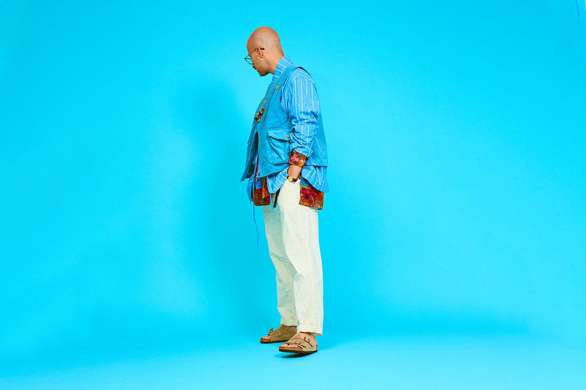 AiE SS20 cream trousers blue background