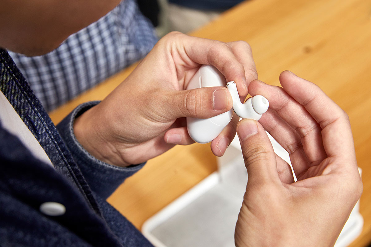 customer holds apple AirPods pro