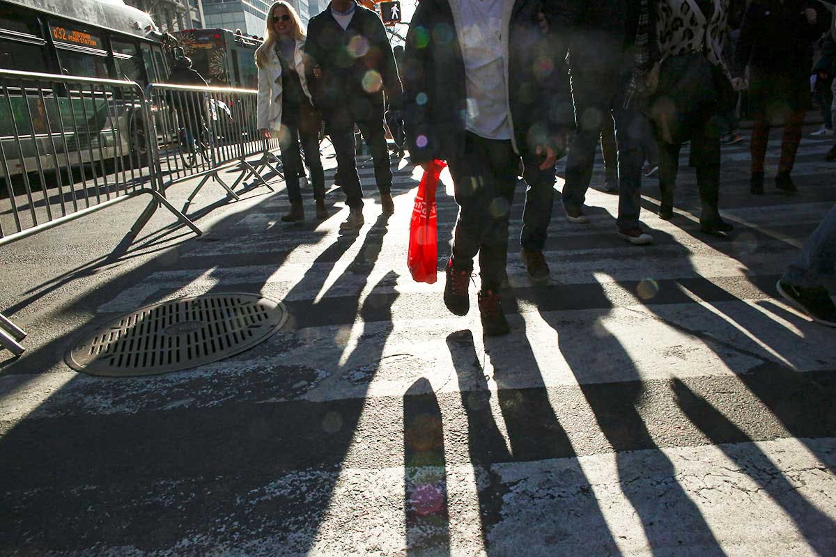 People carry shopping bags in New York City