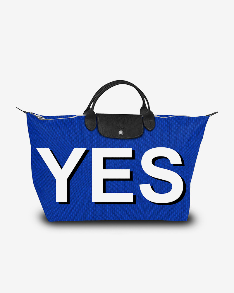 Longchamp bag with "YES" in capital letters